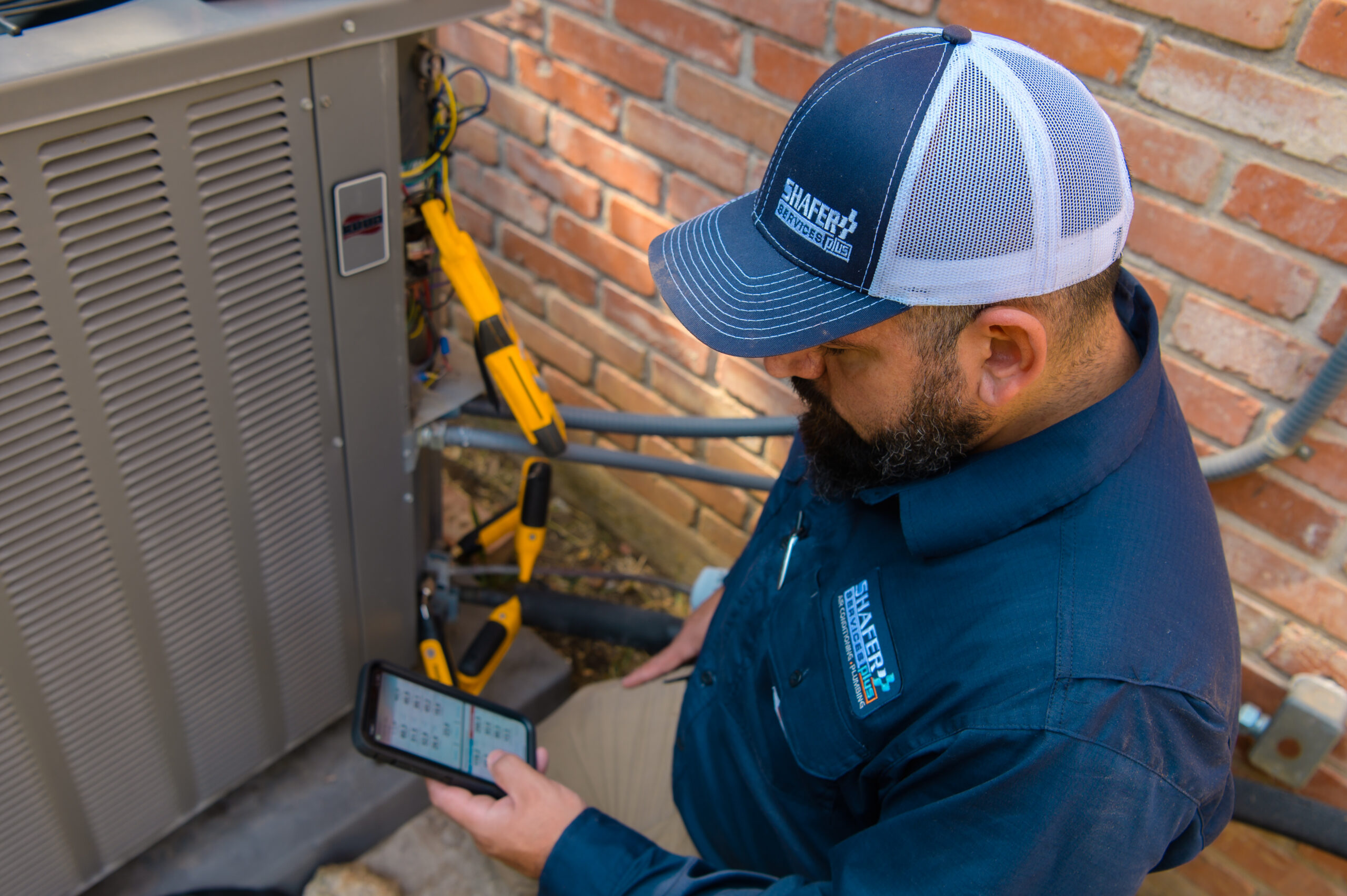 technician checking an AC unit