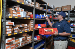 technician grabbing parts